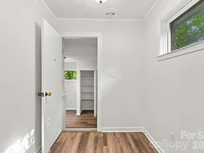 123 Hillside Avenue, Concord, NC 28025.  MLS# CAR4432576, YatesRealty ID 55421. Hallway from Primary to Laundry