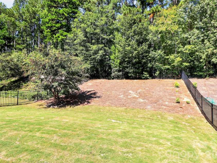 78066 Rillstone Drive, Lancaster, SC 29720.  MLS# CAR4431291, YatesRealty ID 55424. Private fenced in backyard. Backs to trees.