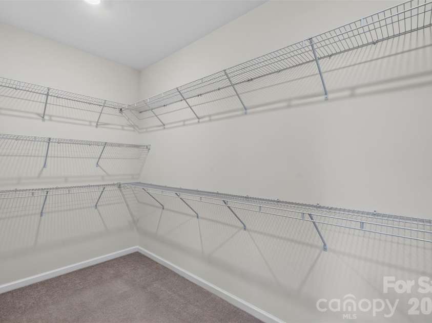 4638 Monument Valley Drive, Indian Land, SC 29707.  MLS# CAR4430010, YatesRealty ID 55436. Large primary bedroom closet for ample storage.