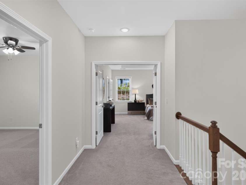 4638 Monument Valley Drive, Indian Land, SC 29707.  MLS# CAR4430010, YatesRealty ID 55436. View into Primary bedroom from second floor hallway.