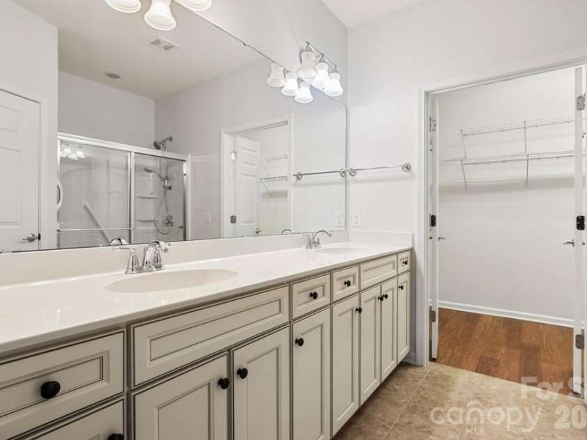 9018 Smokey Hill Lane, Indian Land, SC 29707.  MLS# CAR4431242, YatesRealty ID 55450. Double sinks, shower, and private commode room