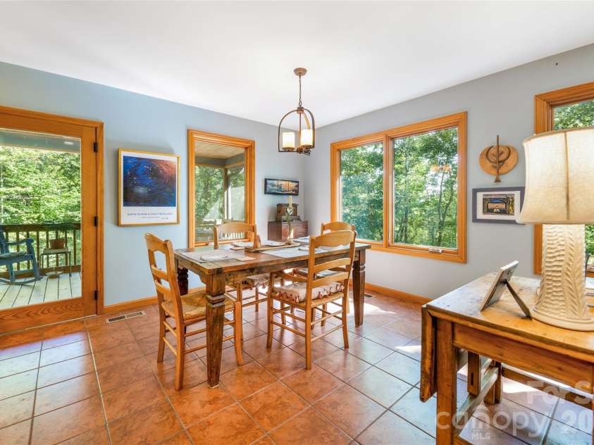 115 Laurel Wood Drive, Mars Hill, NC 28754.  MLS# CAR4431079, YatesRealty ID 55464. Dining area is surrounded by natural light.
