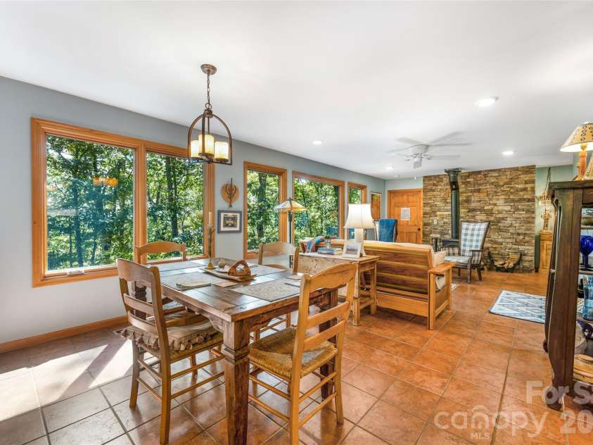 115 Laurel Wood Drive, Mars Hill, NC 28754.  MLS# CAR4431079, YatesRealty ID 55464. Dining area opens into the living room.