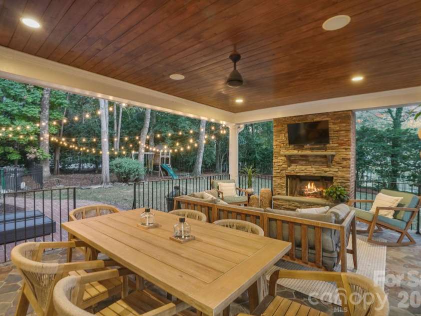 4800 Rockview Court, Charlotte, NC 28226.  MLS# CAR4431140, YatesRealty ID 55471. Wood Fireplace and String Lights