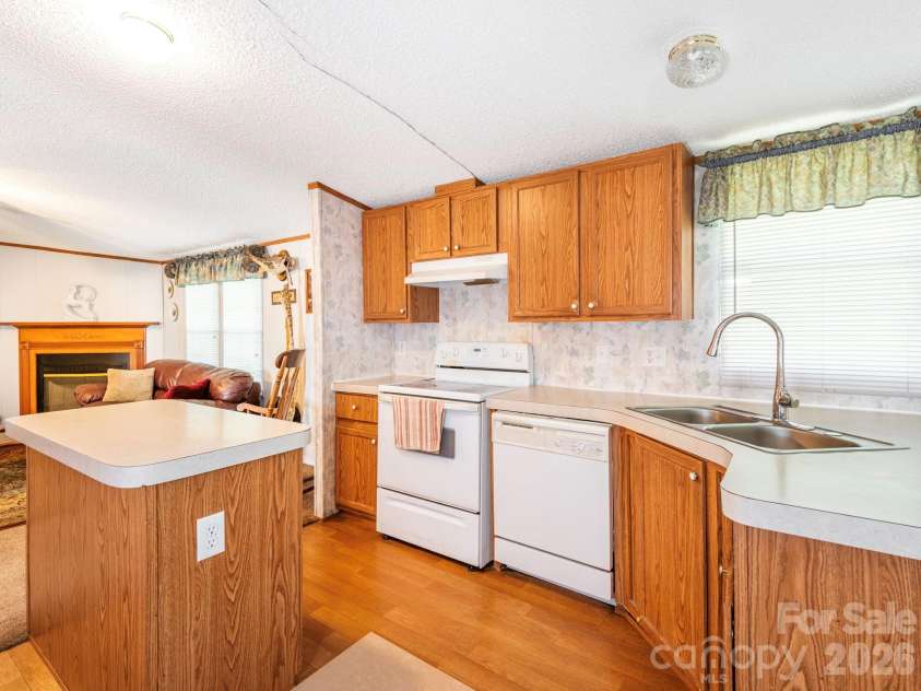 2292 Thornwell Road, Lancaster, SC 29720.  MLS# CAR4422898, YatesRealty ID 55474. Kitchen looking into Living Room