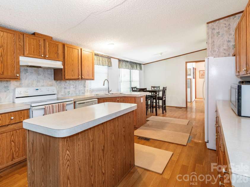 2292 Thornwell Road, Lancaster, SC 29720.  MLS# CAR4422898, YatesRealty ID 55474. Kitchen with Island and Dining Area