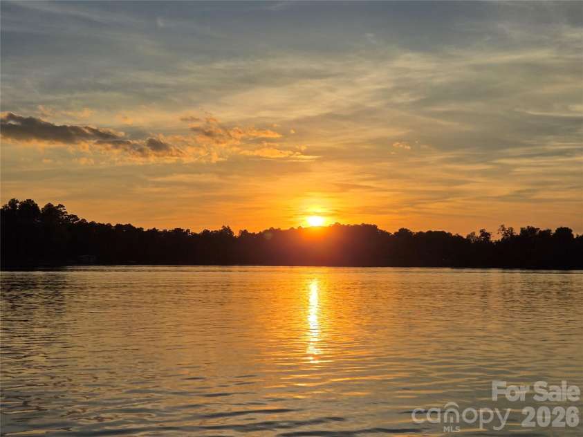 172 Rogers Lane, Badin Lake, NC 28127.  MLS# CAR4429860, YatesRealty ID 55478. Sunset.