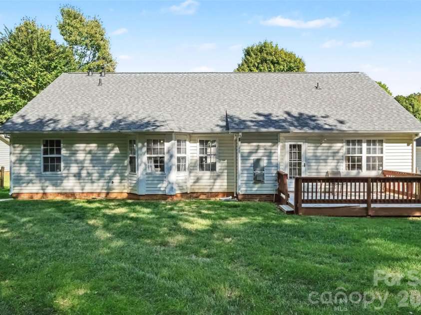 11609 Long Forest Drive, Charlotte, NC 28269.  MLS# CAR4430770, YatesRealty ID 55484. Backyard-deck
