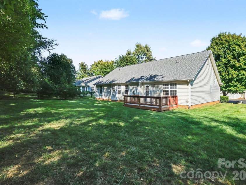 11609 Long Forest Drive, Charlotte, NC 28269.  MLS# CAR4430770, YatesRealty ID 55484. Backyard-deck