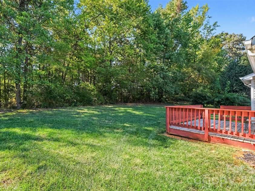 11609 Long Forest Drive, Charlotte, NC 28269.  MLS# CAR4430770, YatesRealty ID 55484. Backyard-deck