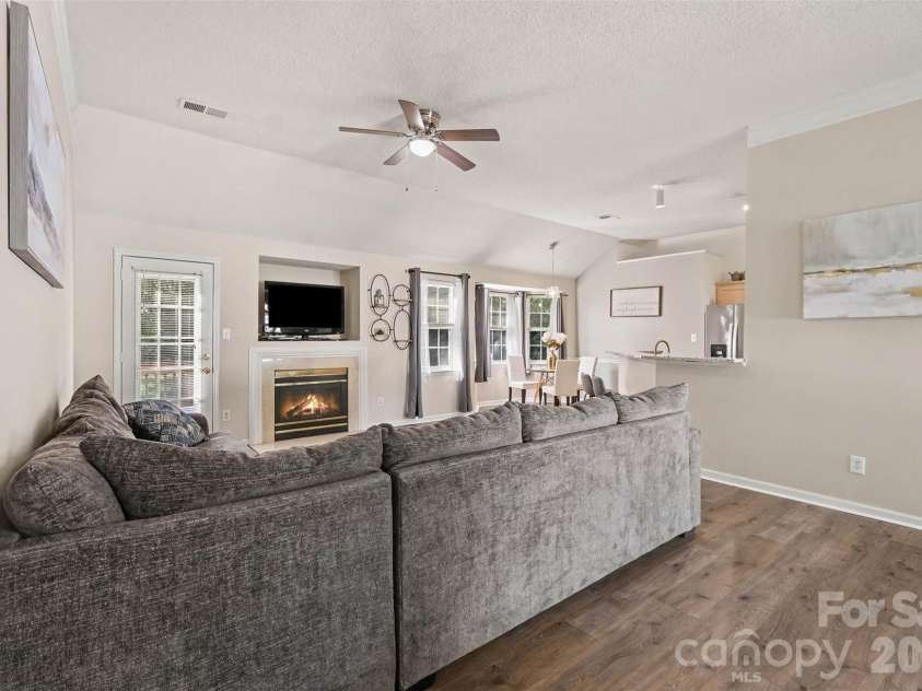 11609 Long Forest Drive, Charlotte, NC 28269.  MLS# CAR4430770, YatesRealty ID 55484. Cozy living area with fireplace