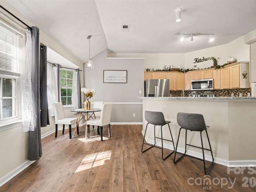 11609 Long Forest Drive, Charlotte, NC 28269.  MLS# CAR4430770, YatesRealty ID 55484. Dining and kitchen breakfast bar