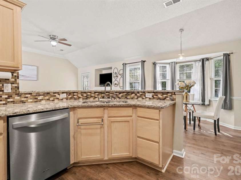 11609 Long Forest Drive, Charlotte, NC 28269.  MLS# CAR4430770, YatesRealty ID 55484. Kitchen-breakfast bar