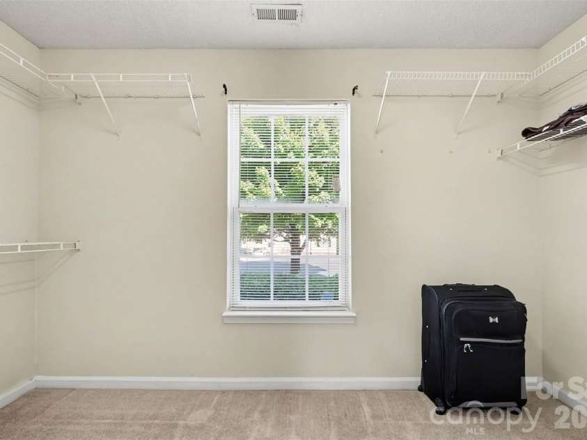 11609 Long Forest Drive, Charlotte, NC 28269.  MLS# CAR4430770, YatesRealty ID 55484. Primary Bedroom walk in closet