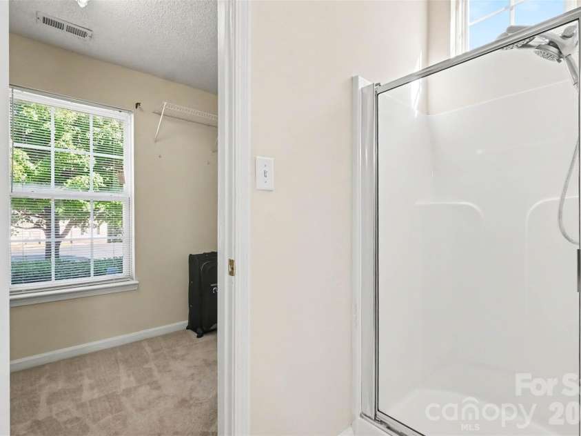 11609 Long Forest Drive, Charlotte, NC 28269.  MLS# CAR4430770, YatesRealty ID 55484. Primary en-suite large bathroom