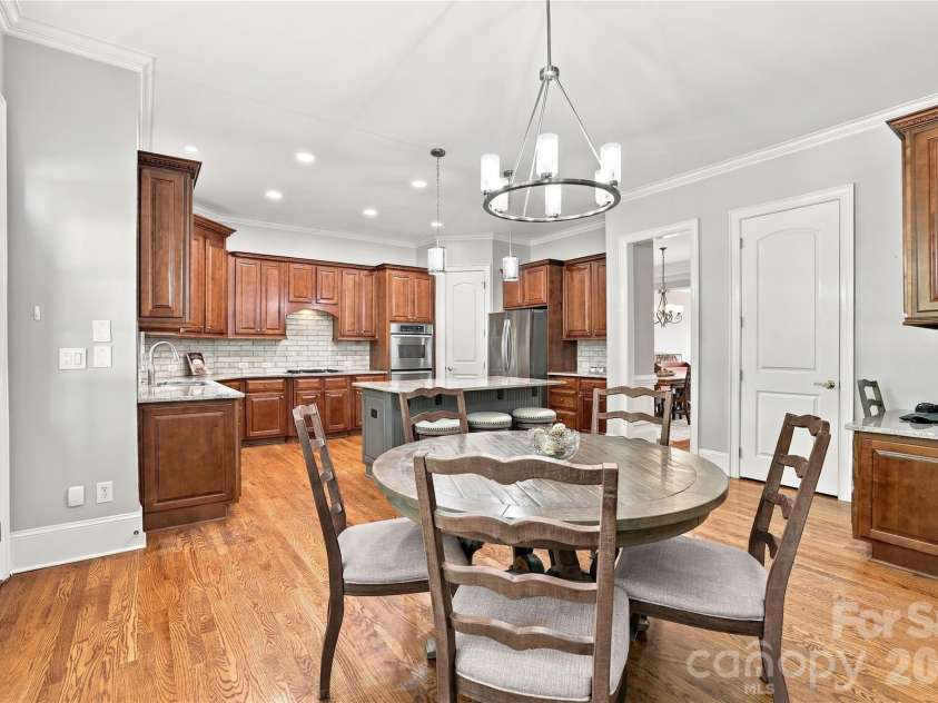 2309 Highland Forest Drive, Waxhaw, NC 28173.  MLS# CAR4430428, YatesRealty ID 55491. More than a breakfast nook, this spacious casual dining area easily accommodates a full-size table with plenty of room for everyday meals, leisurely weekend breakfasts or a table full of family and friends — all ju