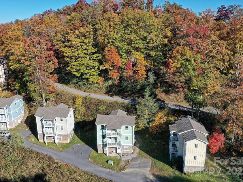 12 Lila Lane, Leicester, NC 28748.  MLS# CAR4254500, YatesRealty ID 555. 12 Lila Lane - 2nd cottage from the right