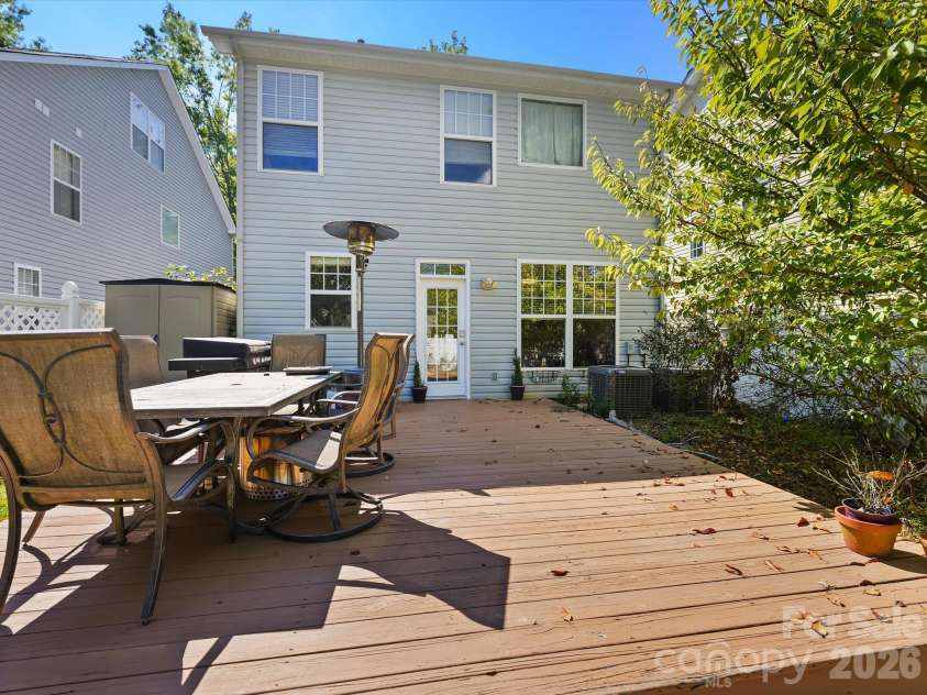 11732 Windy Mist Way, Huntersville, NC 28078.  MLS# CAR4431912, YatesRealty ID 55502. A spacious back deck provides ample room for outdoor dining, entertaining, and relaxing in the private backyard setting.
