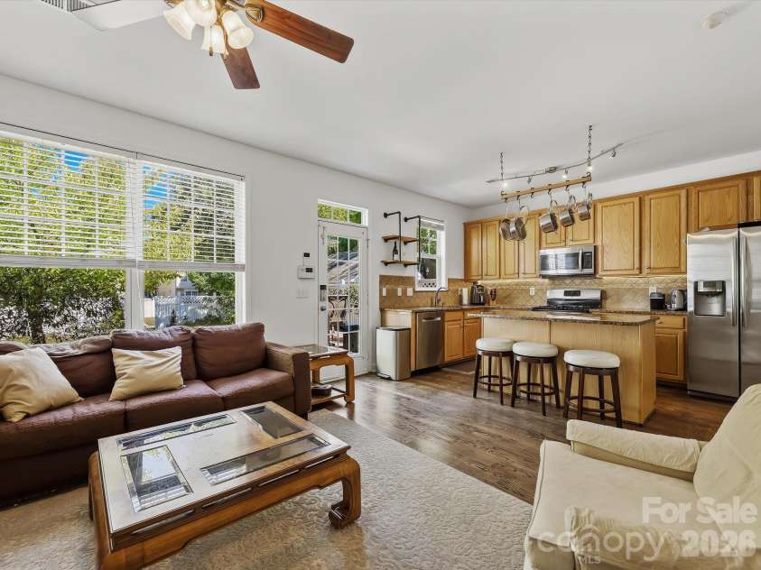 11732 Windy Mist Way, Huntersville, NC 28078.  MLS# CAR4431912, YatesRealty ID 55502. The open-concept great room flows seamlessly into the kitchen, featuring hardwood floors, a cozy fireplace (in 