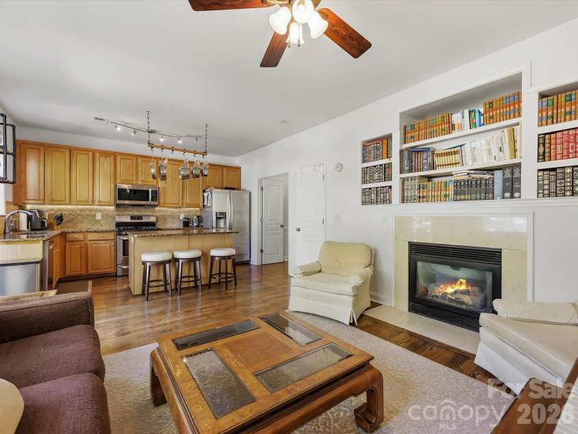11732 Windy Mist Way, Huntersville, NC 28078.  MLS# CAR4431912, YatesRealty ID 55502. The open-concept great room flows seamlessly into the kitchen, featuring hardwood floors, a cozy fireplace (in 