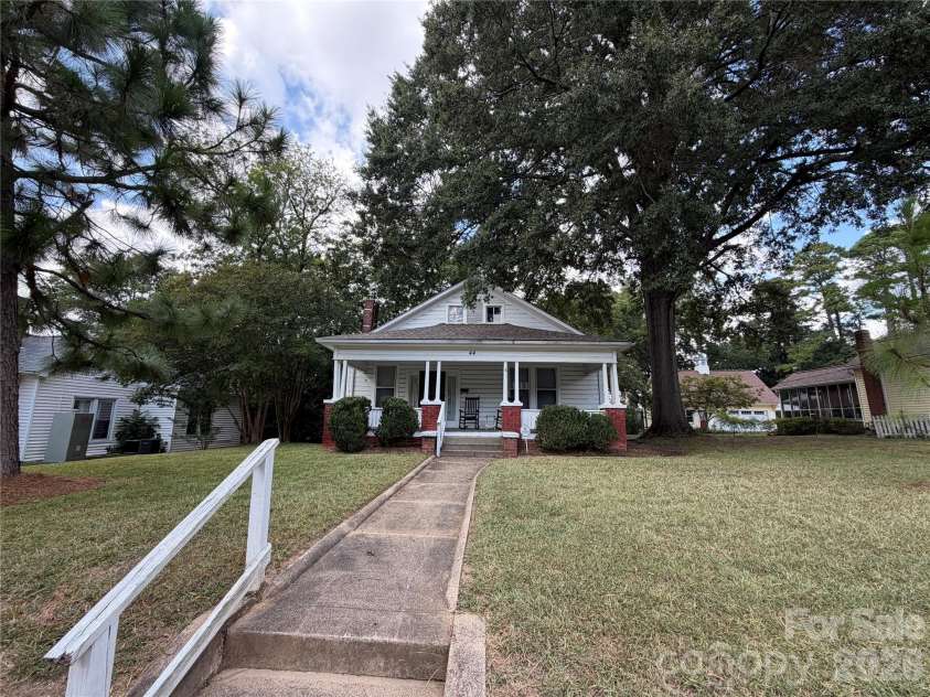 44 Academy Avenue, Concord, NC 28025.  MLS# CAR4432775, YatesRealty ID 55503. Home from street view with nice walkway and handrail for entry.