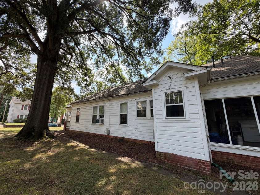 44 Academy Avenue, Concord, NC 28025.  MLS# CAR4432775, YatesRealty ID 55503. Left side of house from back view.