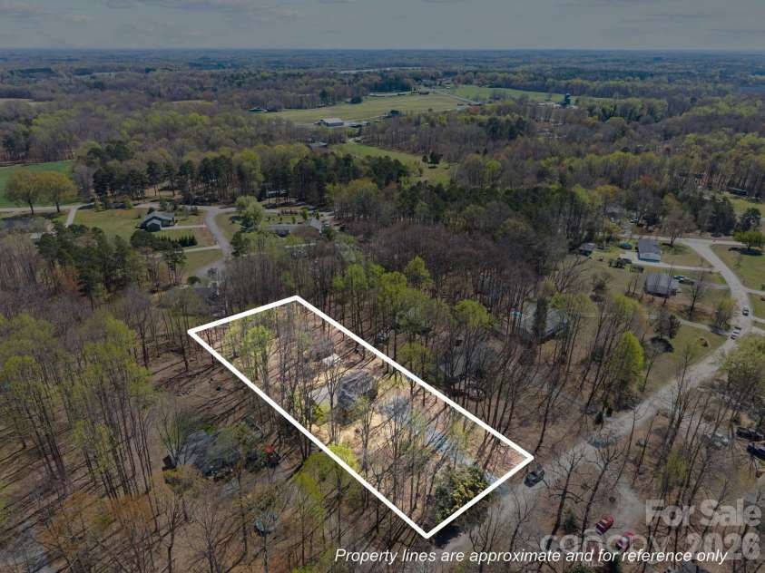 215 Crescent Heights Drive, Salisbury, NC 28146.  MLS# CAR4359710, YatesRealty ID 5552. Almost a full acre to enjoy