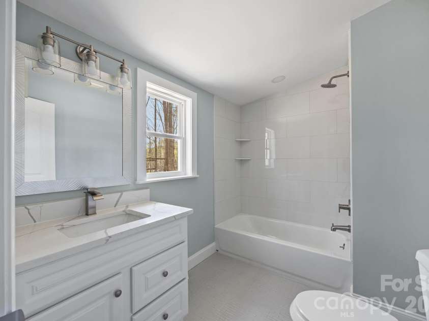 215 Crescent Heights Drive, Salisbury, NC 28146.  MLS# CAR4359710, YatesRealty ID 5552. Primary bedroom 2 en-suite bathroom