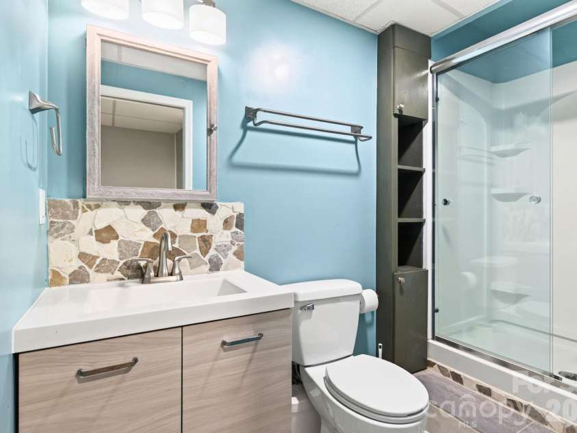 62 Kirby Road, Asheville, NC 28806.  MLS# CAR4431390, YatesRealty ID 55523. Lower Level Full Bathroom