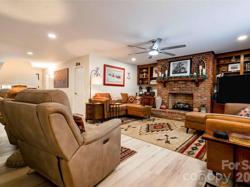 301 Pinkney Street, Shelby, NC 28150.  MLS# CAR4432509, YatesRealty ID 55538. Den with gas log fireplace.