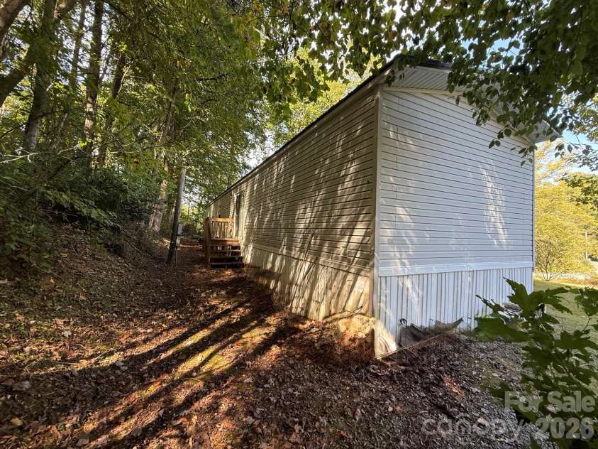 880 G W Whitmire Road, Rosman, NC 28772.  MLS# CAR4427376, YatesRealty ID 55565. Back of Home
