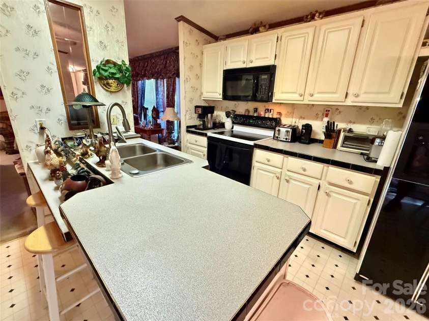 880 G W Whitmire Road, Rosman, NC 28772.  MLS# CAR4427376, YatesRealty ID 55565. Breakfast Bar with Sink
