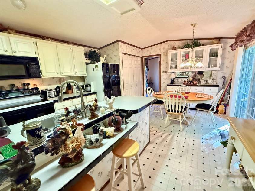 880 G W Whitmire Road, Rosman, NC 28772.  MLS# CAR4427376, YatesRealty ID 55565. Kitchen to Dining Area