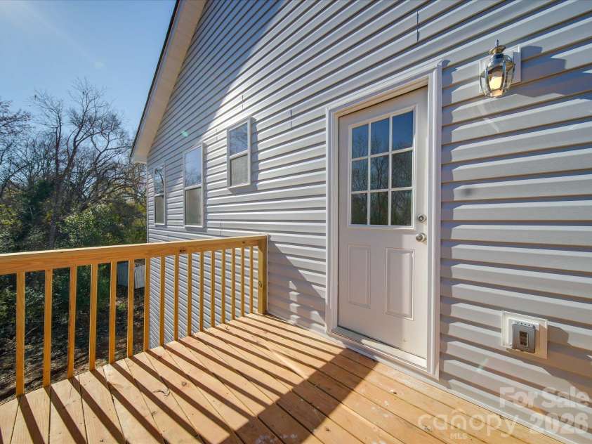 102 Snyder Court, Concord, NC 28025.  MLS# CAR4428517, YatesRealty ID 55579. Deck off kitchen facing backyard