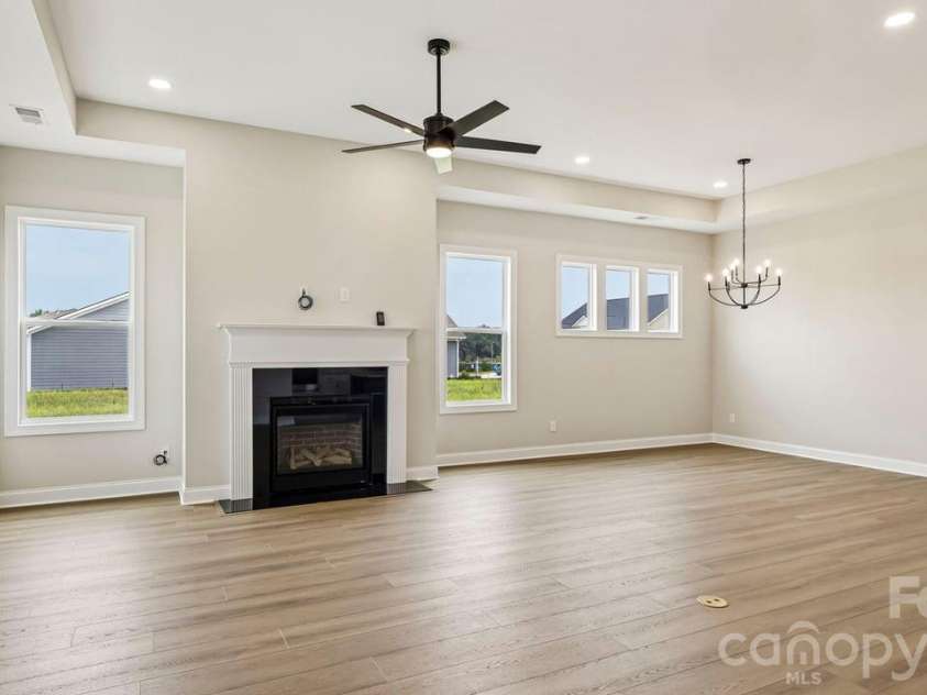205 Marina Bay Trail, Locust, NC 28097.  MLS# CAR4432490, YatesRealty ID 55593. Great Room with Fireplace