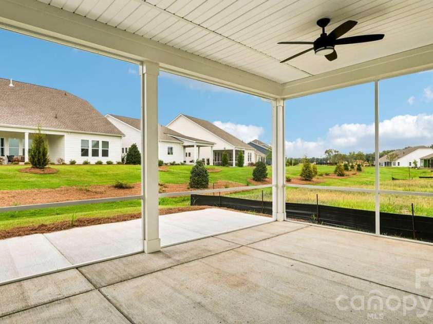 205 Marina Bay Trail, Locust, NC 28097.  MLS# CAR4432490, YatesRealty ID 55593. Screened Covered Lanai and 8 ft Patio Extension