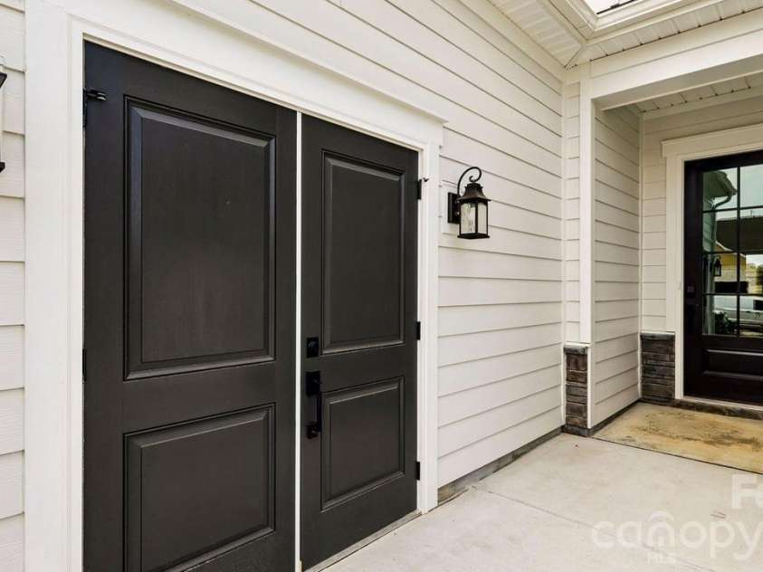 303 Marina Bay Trail, Locust, NC 28097.  MLS# CAR4430586, YatesRealty ID 55596. Golf Cart Garage