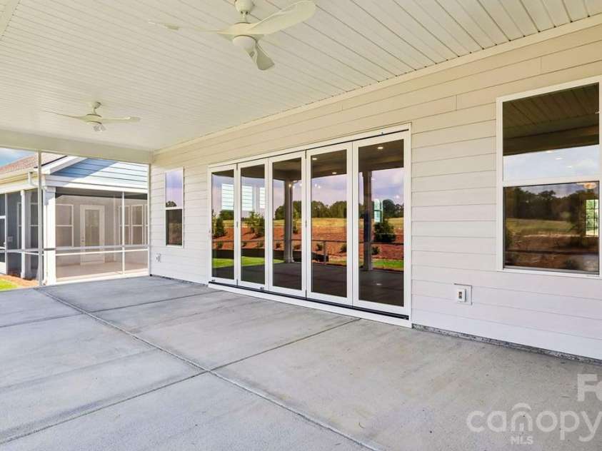 303 Marina Bay Trail, Locust, NC 28097.  MLS# CAR4430586, YatesRealty ID 55596. Screened Covered Lanai