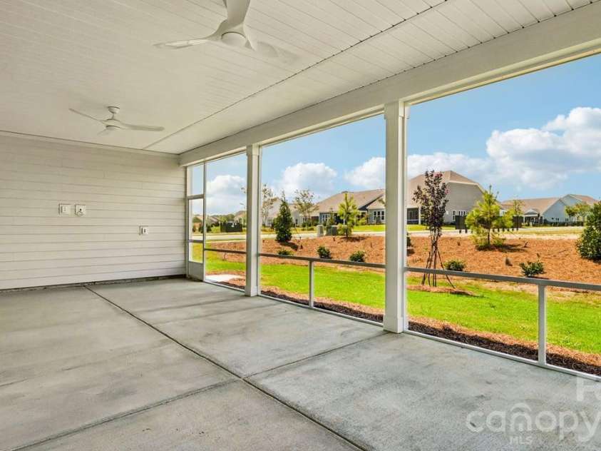 303 Marina Bay Trail, Locust, NC 28097.  MLS# CAR4430586, YatesRealty ID 55596. Screened Covered Lanai