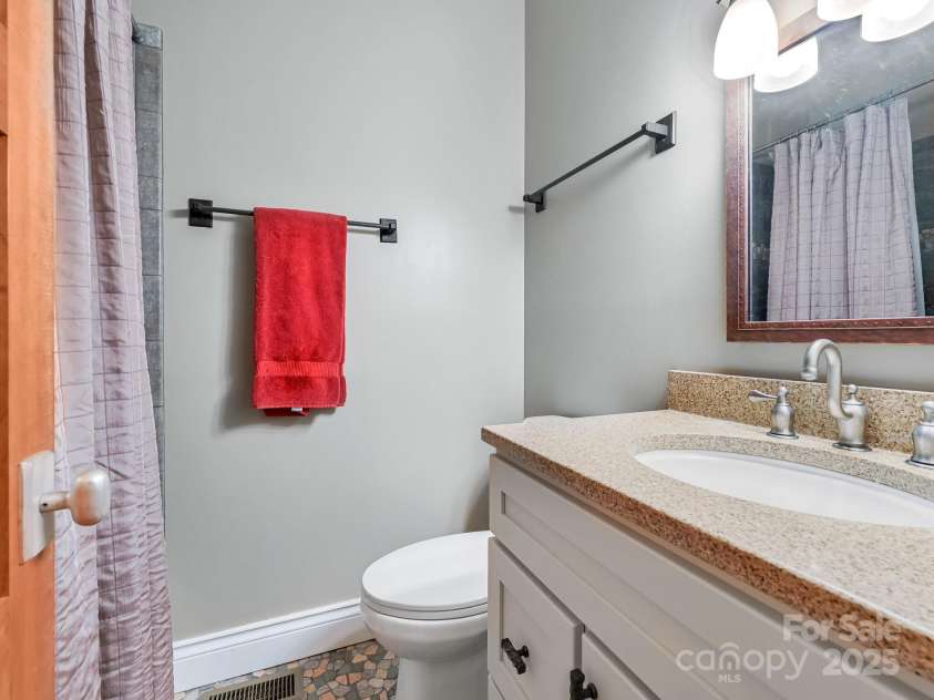 21 Haywood Street, Asheville, NC 28801.  MLS# CAR4183111, YatesRealty ID 556. Full bath with tile shower