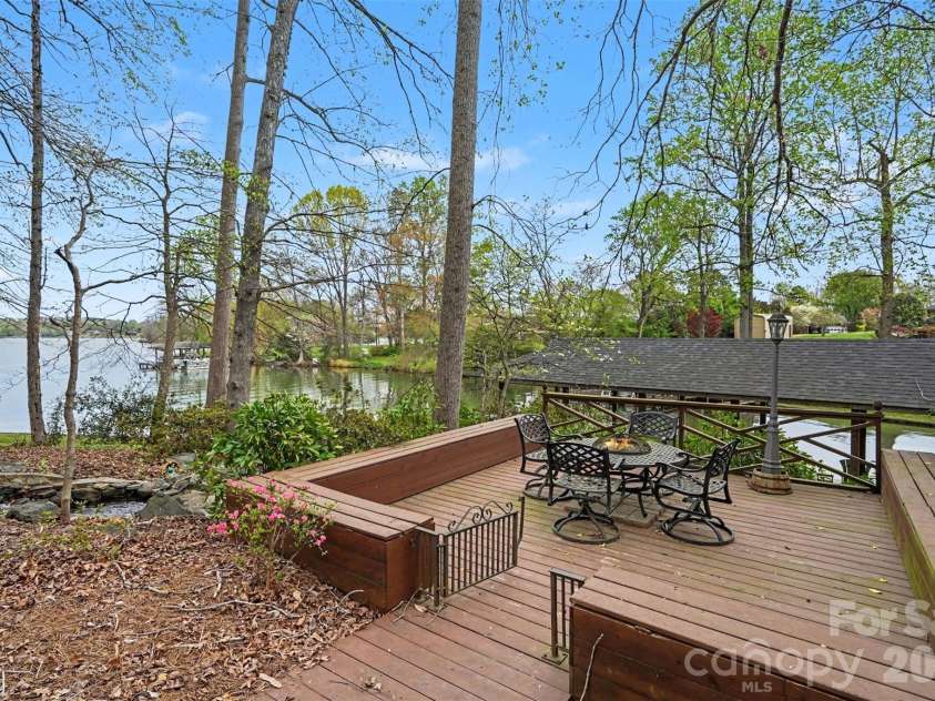 185 Appian Way, Shelby, NC 28150.  MLS# CAR4395118, YatesRealty ID 55602. Separate deck with wrap-around bench seating and an artificial waterfall for enjoying long-range water views!