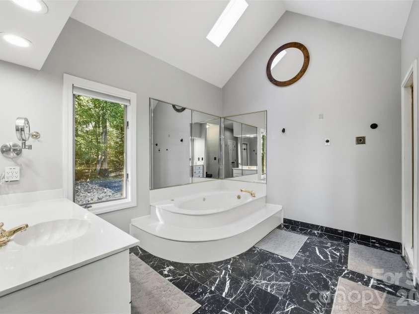 185 Appian Way, Shelby, NC 28150.  MLS# CAR4395118, YatesRealty ID 55602. Vaulted ceiling primary bathroom has a huge whirlpool tub...