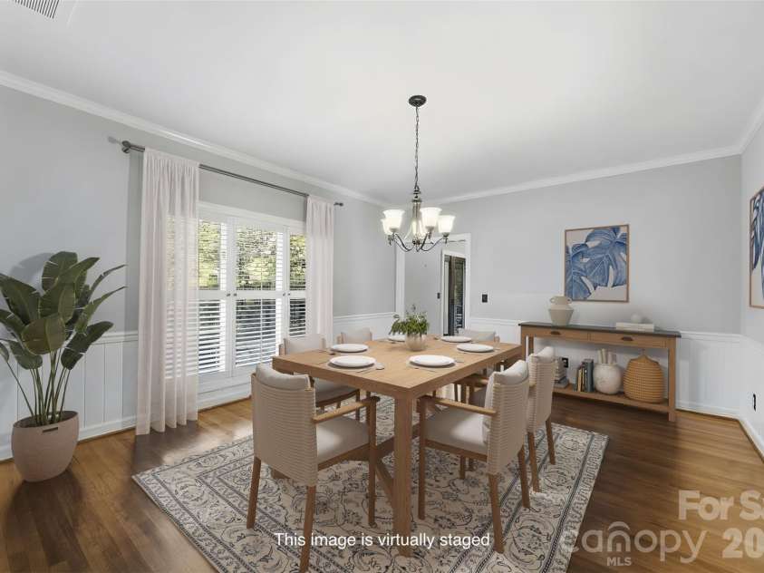 185 Appian Way, Shelby, NC 28150.  MLS# CAR4395118, YatesRealty ID 55602. Virtually staged dining room with large window, chair rail, and wainscoting