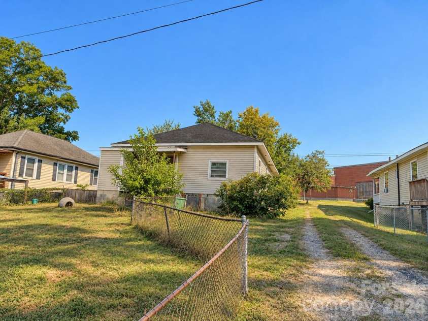 1727 Spencer Mountain Road, Gastonia, NC 28054.  MLS# CAR4432632, YatesRealty ID 55616. Back porch has an additional room/storage space connected