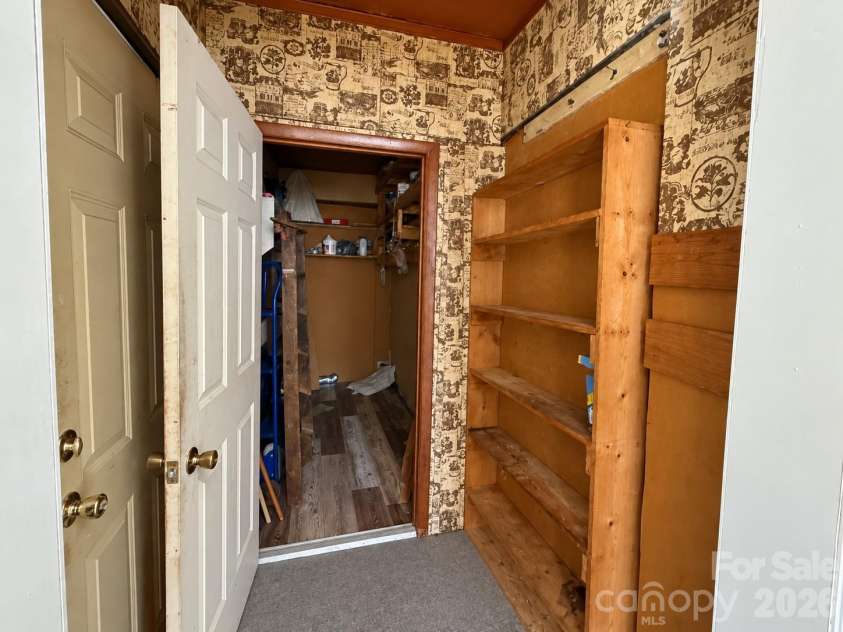 1727 Spencer Mountain Road, Gastonia, NC 28054.  MLS# CAR4432632, YatesRealty ID 55616. Pantry with connected laundry room and storage