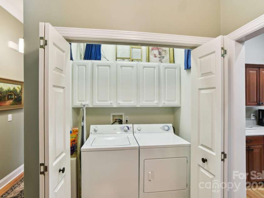 41 Golden Pond Way, Hendersonville, NC 28791.  MLS# CAR4237615, YatesRealty ID 5562. Convenient laundry closet off the kitchen