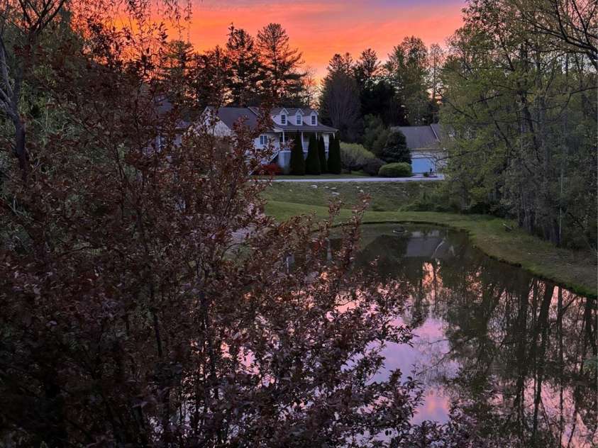 41 Golden Pond Way, Hendersonville, NC 28791.  MLS# CAR4237615, YatesRealty ID 5562. Experience stunning sunsets over the property (photo taken in Aug. 2024)