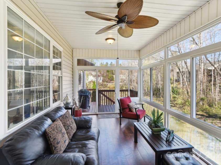 41 Golden Pond Way, Hendersonville, NC 28791.  MLS# CAR4237615, YatesRealty ID 5562. Relax in a heated all-season room with large glass windows