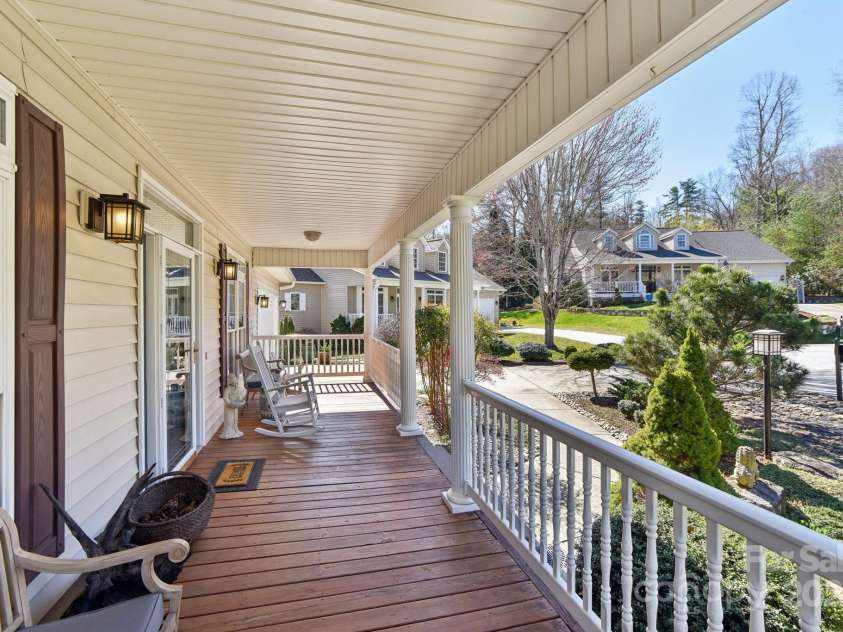 41 Golden Pond Way, Hendersonville, NC 28791.  MLS# CAR4237615, YatesRealty ID 5562. Relax on the amazing rocking chair porch, the perfect spot to unwind and take in the serene views