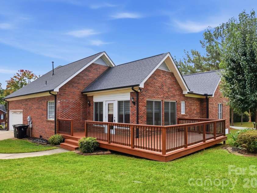 2301 Hunter Davis Court, Monroe, NC 28110.  MLS# CAR4428195, YatesRealty ID 55627. Flat back yard hosts a nice sized deck off the sunroom, perfect for enjoying the sun.